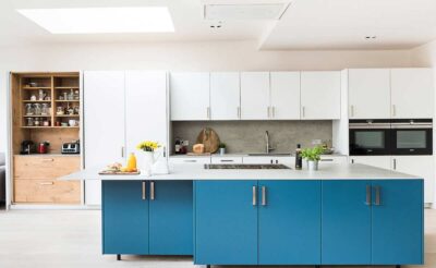 designer modular kitchen with island and multiple drawers and shelves using complete hafele blum fittings