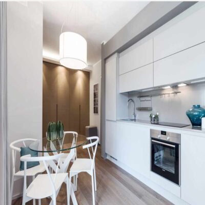 small modular kitchen designs and designer white kitchens with glass dining table in gurgaon